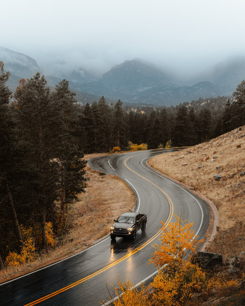 Car Driving Through Road in Mountains 